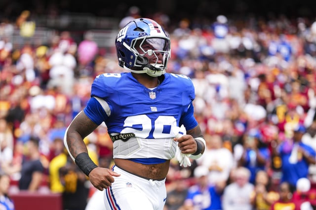 Tyrone Tracy Jr. #29 of the New York Giants runs out of the tunnel prior to an NFL football game against the Washington Commanders at Northwest Stadium on September 7, 2025 in Landover, Maryland.