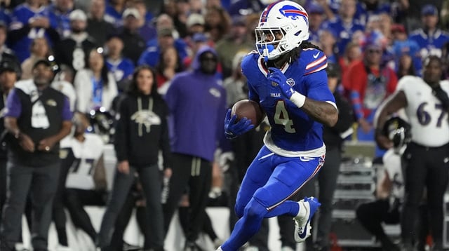Sep 7, 2025; Orchard Park, New York, USA; Buffalo Bills running back James Cook (4) runs the ball against Baltimore Ravens during the third quarter at Highmark Stadium. Mandatory Credit: Gregory Fisher-Imagn Images