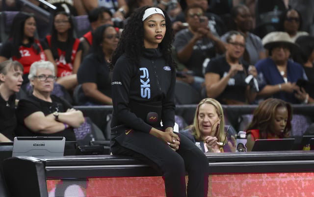 Angel Reese #5 of the Chicago Sky sits on the scorer's table before a game against the Las Vegas Aces at T-Mobile Arena on September 09, 2025 in Las Vegas, Nevada.