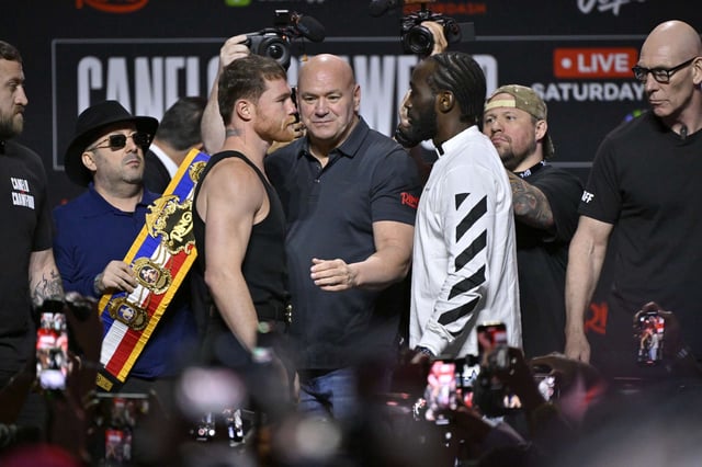 LAS VEGAS, NEVADA - SEPTEMBER 11: Canelo Álvarez (L) and Terence Crawford (R) face off as Dana White (C) looks on during Netflix's Canelo vs Crawford press conference at T-Mobile Arena on September 11, 2025 in Las Vegas, Nevada. (Photo by David Becker/Getty Images for Netflix)
