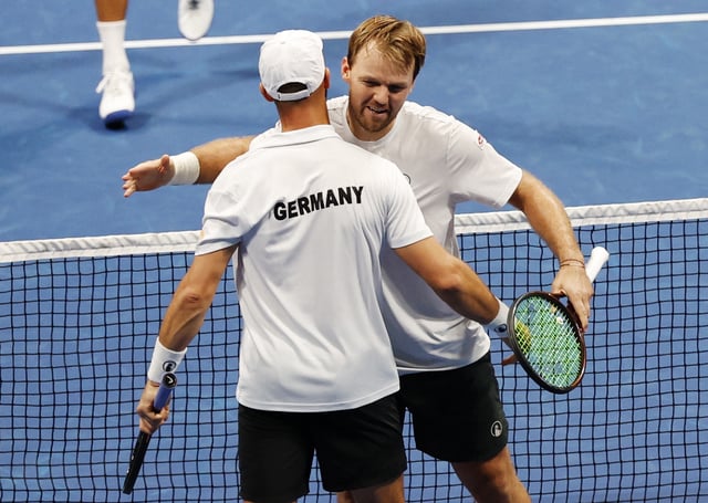 Tennis - Davis Cup - Qualifiers - Second Round - Japan v Germany - Ariake Coliseum, Tokyo, Japan - September 13, 2025 Germany's Kevin Krawietz and Tim Puetz celebrate after winning their doubles match against Japan's Yosuke Watanuki and Takeru Yuzuki REUTERS/Manami Yamada