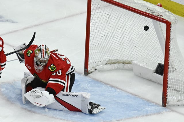 Apr 12, 2025; Chicago, Illinois, USA;  Chicago Blackhawks goaltender Spencer Knight (30) misses a shot on goal by Winnipeg Jets defenseman Josh Morrissey (44) during the third period at United Center. Mandatory Credit: Matt Marton-Imagn Images/File Photo
