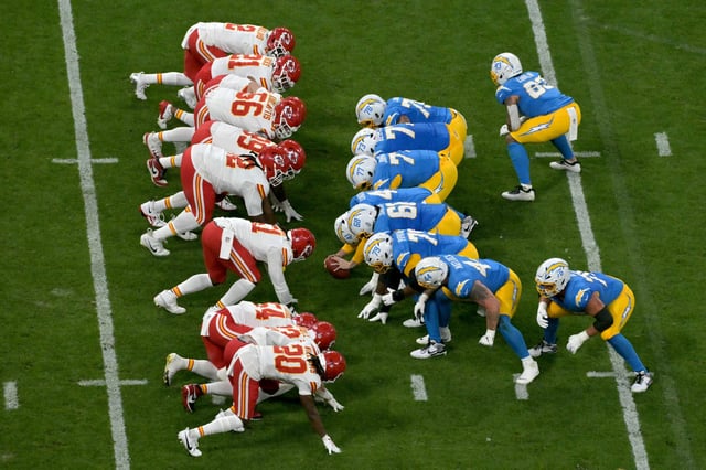 Los Angeles players prepare for a play against the Kansas City players during the NFL game between the Kansas City Chiefs and Los Angeles Chargers at the Neo Quimica Arena Stadium in Sao Paulo, Brazil, on September 5, 2025.