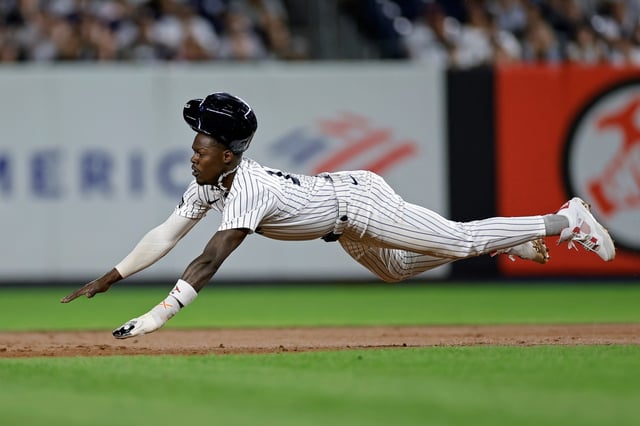 New York Yankees' Jazz Chisholm Jr. dives to steal second base during the second inning of a baseball game against the Detroit Tigers, Thursday, Sept. 11, 2025, in New York. (AP Photo/Adam Hunger)