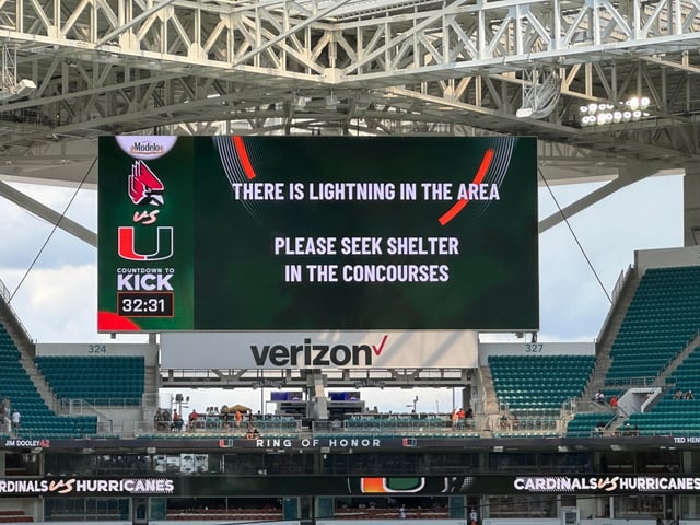 The Hurricanes' home game against USF at Hard Rock Stadium was delayed due to lightning. (Adam Lichtenstein / South Florida Sun Sentinel).