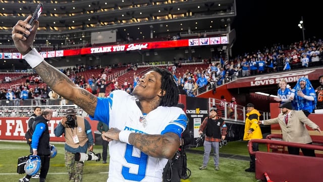 Detroit Lions wide receiver Jameson Williams takes a selfie to celebrate the 40-34 win over the San Francisco 49ers as he exits the field at Levi's Stadium in Santa Clara, Calif. on Monday, Dec. 30, 2024.