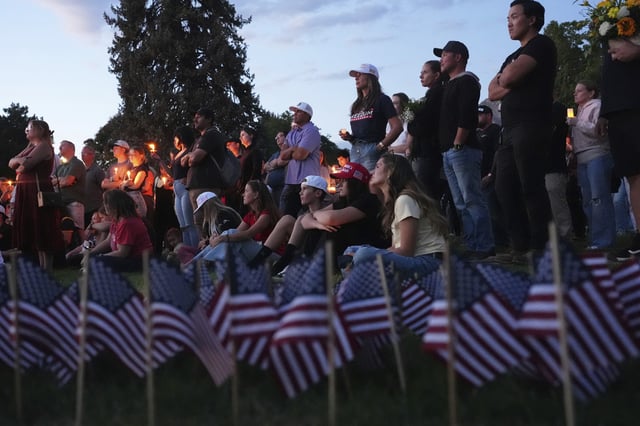 Attendees pay their respects at a vigil for Charlie Kirk on Friday, Sept. 12, 2025, in Provo, Utah.