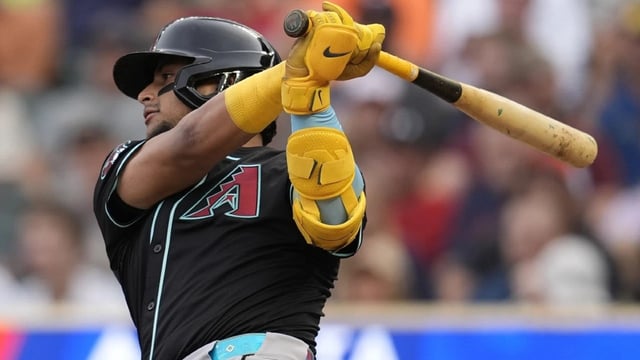 Arizona Diamondbacks' Gabriel Moreno (14) hits a single in the first inning of a baseball game against the Minnesota Twins Saturday, Sept. 13, 2025, in Minneapolis (AP Photo/Mike Stewart)