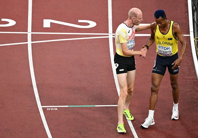 The pair shake hands after the race.