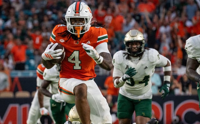Brian Mulvey Assistant Photo Editor // Junior running Back Mark Fletcher Jr. runs through the USF defense on Sept. 13 2025
