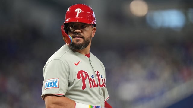 Sep 6, 2025; Miami, Florida, USA; Philadelphia Phillies designated hitter Kyle Schwarber (12) looks back after getting hit by a pitch in the seventh inning against the Miami Marlins at loanDepot Park. Mandatory Credit: Jim Rassol-Imagn Images