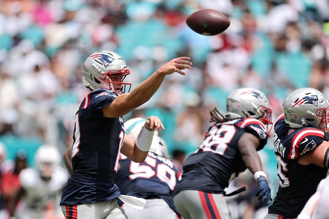 MIAMI GARDENS, FLORIDA - SEPTEMBER 14: Drake Maye #10 of the New England Patriots attempts a pass against the Miami Dolphins during the second quarter in the game at Hard Rock Stadium on September 14, 2025 in Miami Gardens, Florida.
