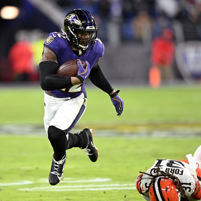 BALTIMORE, MARYLAND - JANUARY 04: Derrick Henry #22 of the Baltimore Ravens runs the ball past Mike Ford Jr. #31 of the Cleveland Browns during the third quarter at M&T Bank Stadium on January 04, 2025 in Baltimore, Maryland. (Photo by Greg Fiume/Getty Images)