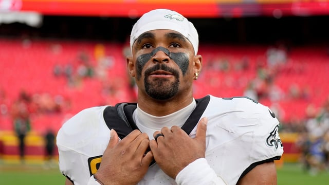 Philadelphia Eagles quarterback Jalen Hurts pauses on the field following an NFL football game against the Kansas City Chiefs Sunday.