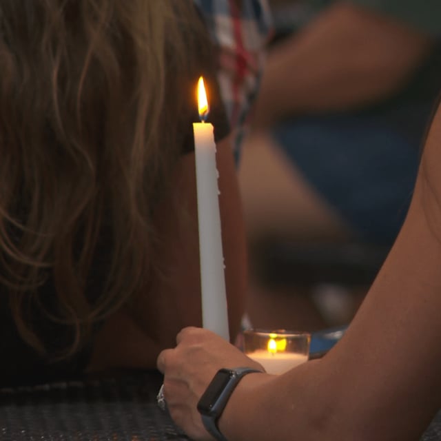 Dozens of people gathered Sunday night at Veterans Park off of Valleydale Road for a candlelight vigil to remember Charlie Kirk. (abc3340.com){p}{/p}