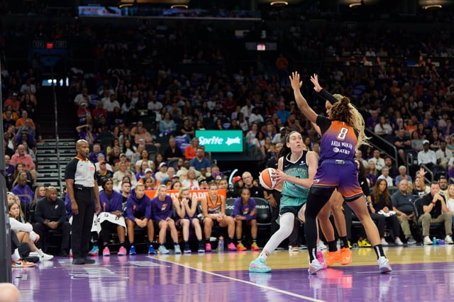 Sep 14, 2025; Phoenix, Arizona, USA; New York Liberty forward Breanna Stewart (30) is doubled teamed by Phoenix Mercury guard Monique Akoa Makani (8) and forward Satou Sabally (0) in the second half during game one of the 2025 WNBA Playoffs round one at PHX Arena. Mandatory Credit: Allan Henry-Imagn Images