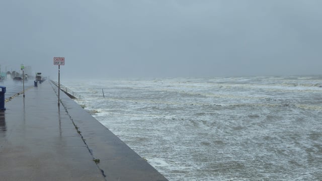 Stock Image: Tropical Alberto Storm surge pushing waves against seawall in Galveston, Texas.