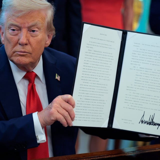 WASHINGTON, DC - AUGUST 25: U.S. President Donald Trump signs executive orders in the Oval Office at the White House on August 25, 2025 in Washington, DC. Furthering his federal takeover of the capital city’s law enforcement, Trump signed orders ending cashless bail in the District of Columbia, mandating prosecution for people who desecrate the American flag -- including by burning it -- and other orders. (Photo by Chip Somodevilla/Getty Images)