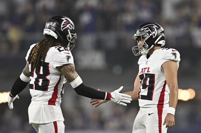 MINNEAPOLIS, MINNESOTA - SEPTEMBER 14: Kicker John Parker Romo #39 celebrates a field goal against the Minnesota Vikings with teammate Mike Ford Jr. #28 of the Atlanta Falcons during the first quarter in the game at U.S. Bank Stadium on September 14, 2025 in Minneapolis, Minnesota.