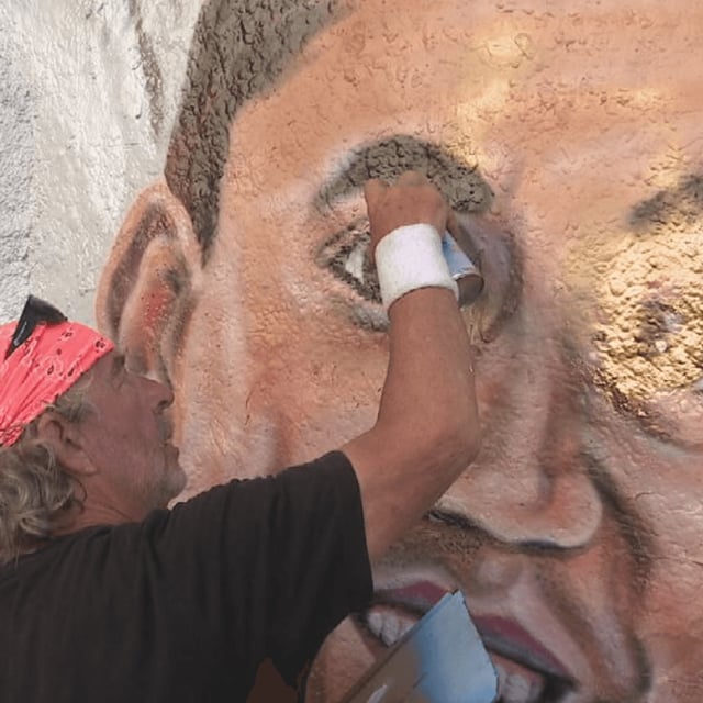 Pensacola's candlelight vigil for Charlie Kirk Sunday evening turned violent when someone attempted to spray over the Graffiti Bridge mural of the conservative activist/WEAR