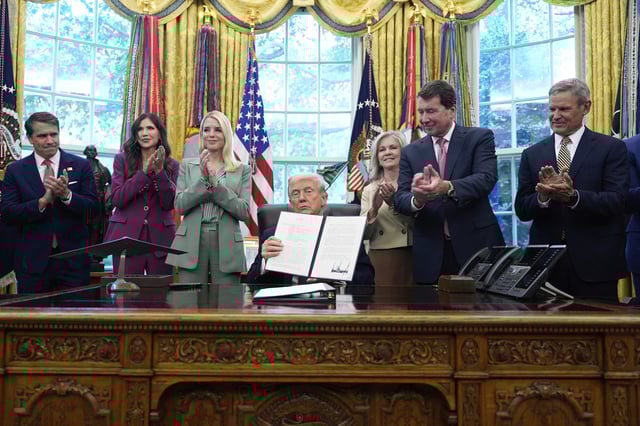 President Donald Trump holds a signed memorandum titled "Restoring Law and Order in Memphis" as, from left, Deputy Attorney General Todd Blanche, Homeland Security Secretary Kristi Noem, Attorney General Pam Bondi, Sen. Marsha Blackburn, R-Tenn., Sen. Bill Hagerty, R-Tenn., and Tennessee Gov. Bill Lee look on in the Oval Office of the White House, Monday, Sept. 15, 2025, in Washington.