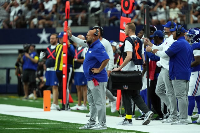 Sep 14, 2025; Arlington, Texas, USA; New York Giants head coach Brian Daboll stands on the sidelines during game against the Dallas Cowboys at AT&T Stadium. Mandatory Credit: Raymond Carlin III-Imagn Images