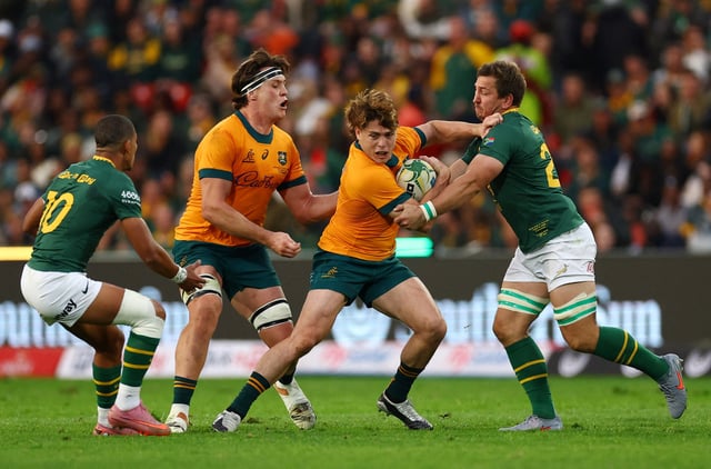 Rugby Union - Rugby Championship - South Africa v Australia - Ellis Park, Johannesburg, South Africa - August 16, 2025 Australia's James O'Connor in action with South Africa's Kwagga Smith REUTERS/Siphiwe Sibeko/File Photo