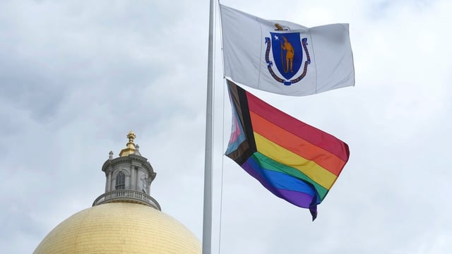 The Massachusetts state flag, along with the Pride flag, flown in June.