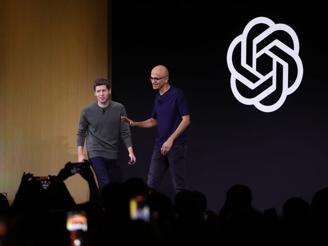 Microsoft and OpenAI CEOs Satya Nadella and Sam Altman at OpenAI's first developer conference.