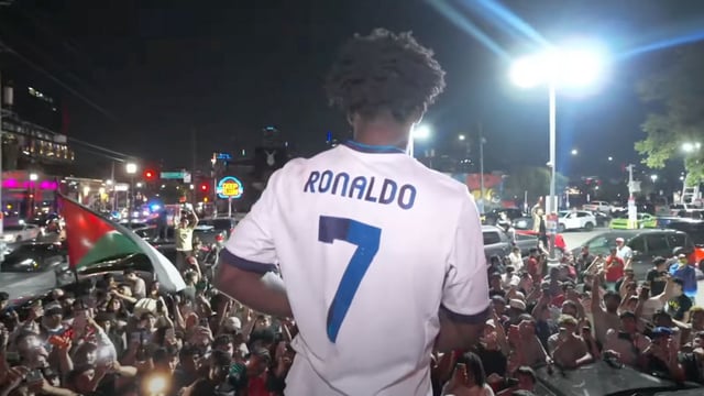 IShowSpeed stood on top of car with massive crowd in background