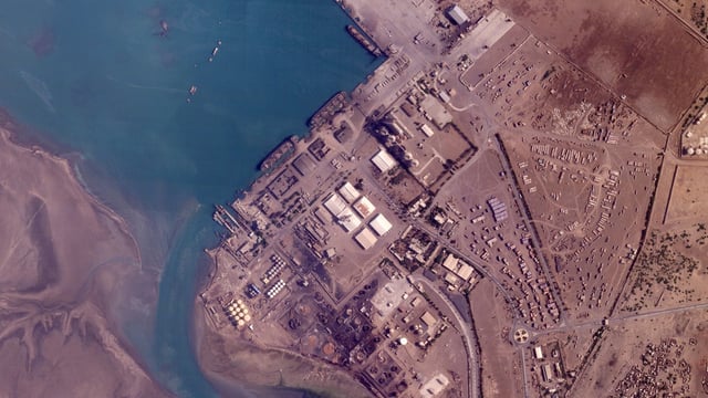 Damage seen after earlier Israeli airstrikes targeting the port in Hodeida, Yemen.