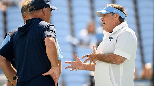 Sep 13, 2025; Chapel Hill, North Carolina, USA; North Carolina Tar Heels head coach Bill Belichick with Richmond Spiders head coach Russ Huesman before the game at Kenan Stadium. Mandatory Credit: Bob Donnan-Imagn Images