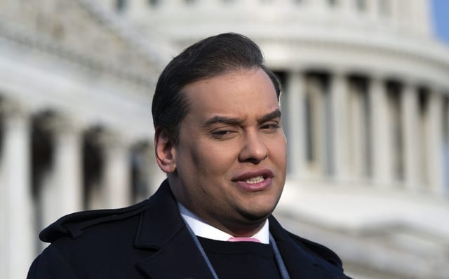 FILE - George Santos faces reporters at the Capitol in Washington, early Thursday, Nov. 30, 2023. (AP Photo/J. Scott Applewhite)