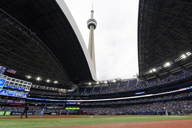 TORONTO, ON - JUNE 1: Kevin Gausman #34 of Toronto Blue Jays delivers a pitch to the Athletics in a general view of the stadium under the CN Tower as the dome opens during the third inning in their MLB game at the Rogers Centre on June 1, 2025 in Toronto, Ontario, Canada. (Photo by Mark Blinch/Getty Images)