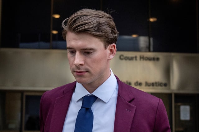 Carter Hart leaves court after a judge found him and his teammates not guilty in the trial involving players from Canada’s 2018 gold medal–winning world junior hockey team, who were charged with sexually assaulting a woman in a hotel room, at the Superior Court of Justice in London, Ontario, Canada, July 24, 2025. REUTERS/Carlos Osorio/File Photo