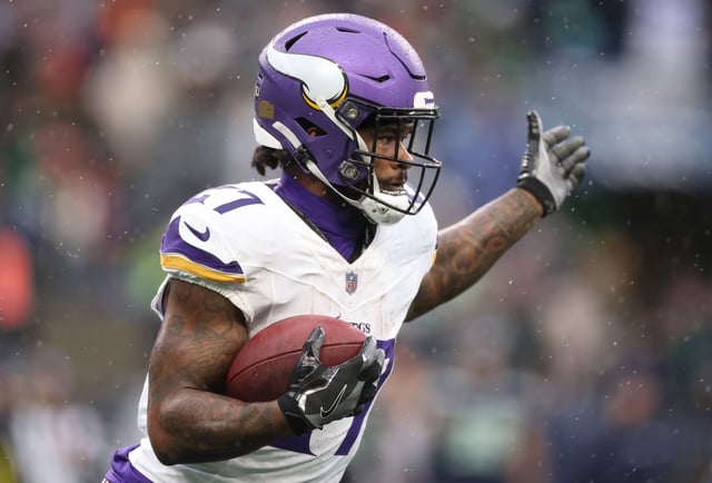 SEATTLE, WASHINGTON - DECEMBER 22: Cam Akers #27 of the Minnesota Vikings carries the ball against the Seattle Seahawks during the second quarter at Lumen Field on December 22, 2024 in Seattle, Washington.