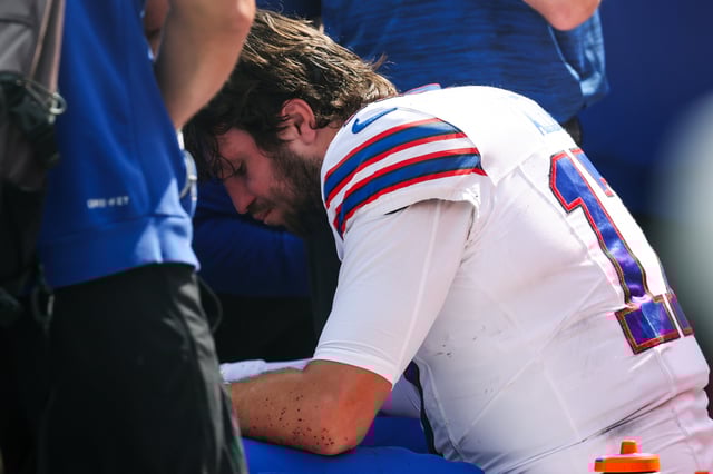 EAST RUTHERFORD, NEW JERSEY - SEPTEMBER 14: Josh Allen #17 of the Buffalo Bills is attended to by trainers after sustaining an injury during the first half against the New York Jets at MetLife Stadium on September 14, 2025 in East Rutherford, New Jersey.