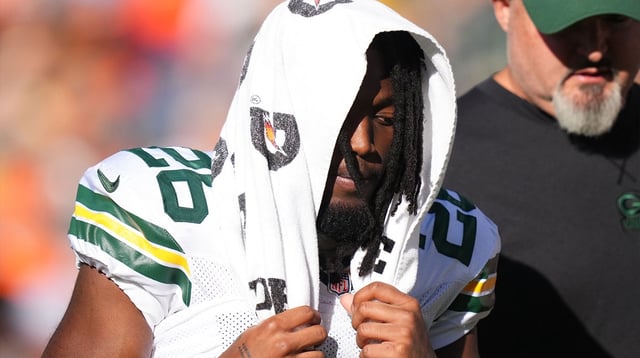 Oct 22, 2023; Denver, Colorado, USA; Green Bay Packers safety Darnell Savage (26) leaves the filed in the second quarter against the Denver Broncos at Empower Field at Mile High. Mandatory Credit: Ron Chenoy-Imagn Images
