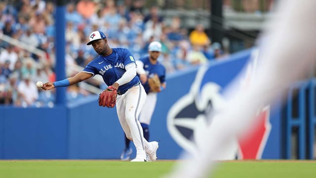 Mar 16, 2025; Dunedin, Florida, USA; Toronto Blue Jays second baseman Orelvis Martinez (13) throws to first for an out against the Atlanta Braves in the fifth inning during spring training at TD Ballpark. Mandatory Credit: Nathan Ray Seebeck-Imagn Images