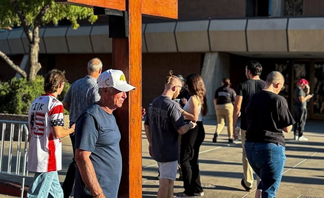 Dan Beasley, of Northville, Mich., stands outside Arizona State University’s Desert Financial Arena ahead of Turning Point USA ASU Chapter’s vigil for Charlie Kirk on Monday, Sept. 15, 2025.
