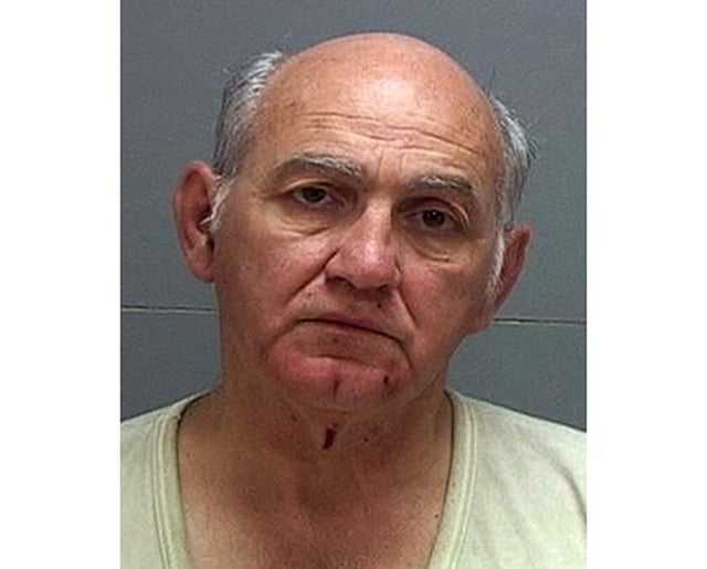 George Zinn, pictured in a 2013 booking photo, is charged with obstruction and sexual exploitation of a minor.