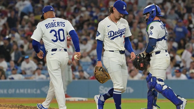 Sep 16, 2025; Los Angeles, California, USA; Los Angeles Dodgers manager Dave Roberts (30) pulls relief pitcher Justin Wrobleski (70) during the sixth inning against the Philadelphia Phillies at Dodger Stadium. Mandatory Credit: Jayne Kamin-Oncea-Imagn Images