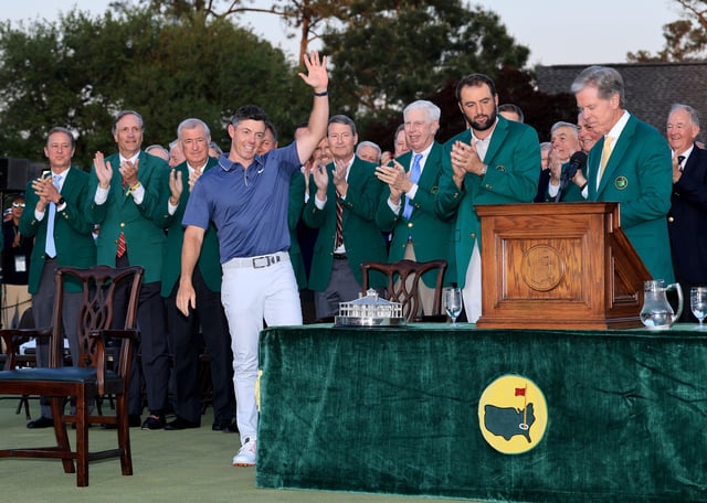 AUGUSTA, GEORGIA - APRIL 13: Rory McIlroy of Northern Ireland acknowledges the applause as he prepares to receive his Green Jacket from the 2024 Champion Scottie Scheffler of The United States at the official presentation ceremony after the final round of the 2025 Masters Tournament at Augusta National Golf Club on April 13, 2025 in Augusta, Georgia. (Photo by David Cannon/Getty Images)