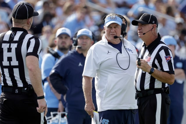North Carolina head coach Bill Belichick discusses a call with the officials during the first half of an NCAA college football game against Richmond, Saturday, Sept. 13, 2025, in Chapel Hill, N.C. (AP Photo/Chris Seward)