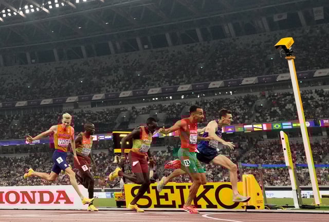 World Athletics Championships Tokyo 2025 - Men's 1500m Final - Japan National Stadium, Tokyo, Japan - September 17, 2025 Portugal's Isaac Nader crosses the line to win the final ahead of second placed Britain's Jake Wightman and third placed Kenya's Reynold Cheruiyot REUTERS/Pawel Kopczynski