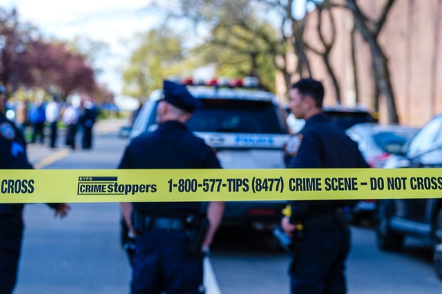 --FOR WEB STOCK--NYPD officers and detectives collect evidence on 188th Street in Fresh Meadows where multiple people were shot, Wednesday, April 27, 2022. (Jeff Bachner/New York Daily News)