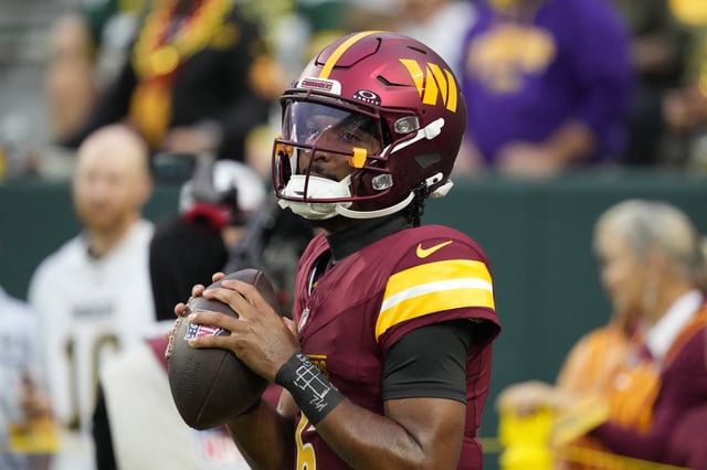 Sep 11, 2025; Green Bay, Wisconsin, USA; Washington Commanders quarterback Jayden Daniels (5) warms up before a game against the Green Bay Packers at Lambeau Field. Mandatory Credit: Jeff Hanisch-Imagn Images/File Photo