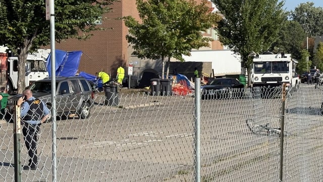 Minneapolis city officials start clearing a homeless encampment along East Lake Street and 28th Avenue on Sept. 16, 2025, the morning after a mass shooting hurt eight people. (KSTP-TV)