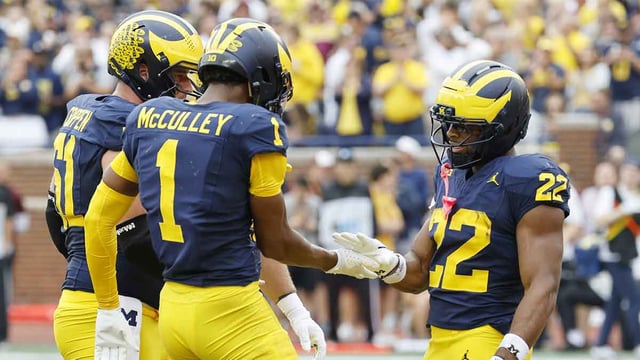 Sep 13, 2025; Ann Arbor, Michigan, USA; Michigan Wolverines running back Justice Haynes (22) receives congratulations from offensive lineman Greg Crippen (51) and wide receiver Donaven McCulley (1) after scoring in the first half against the Central Michigan Chippewas at Michigan Stadium. Mandatory Credit: Rick Osentoski-Imagn Images