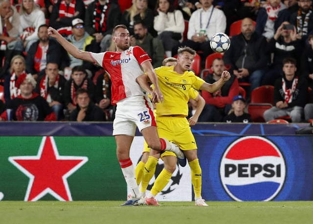 Soccer Football - UEFA Champions League - Slavia Prague v Bodo/Glimt - Fortuna Arena, Prague, Czech Republic - September 17, 2025 Slavia Prague's Tomas Chory in action with Bodo/Glimt's Odin Bjortuft REUTERS/Eva Korinkova